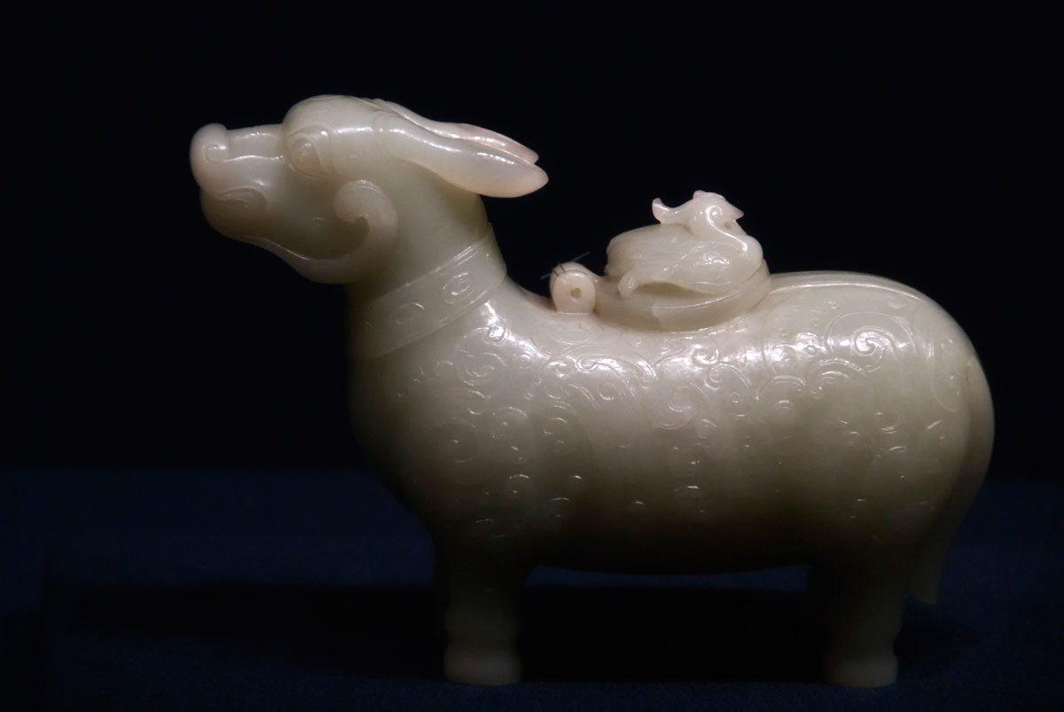Ox-shaped xun (wine vessel) carved from Chinese nephrite on display in Shanghai's Shanghai Museum. Quianlong Reign (AD 1736–1795). Qing Dynasty. Over the past two decades the Chinese have rediscovered their love of nephrite jade, with the white stone from Hotan now fetching near-jadeite prices. Lotus Gemology explores jade, nephrite, Chinese nephrite.