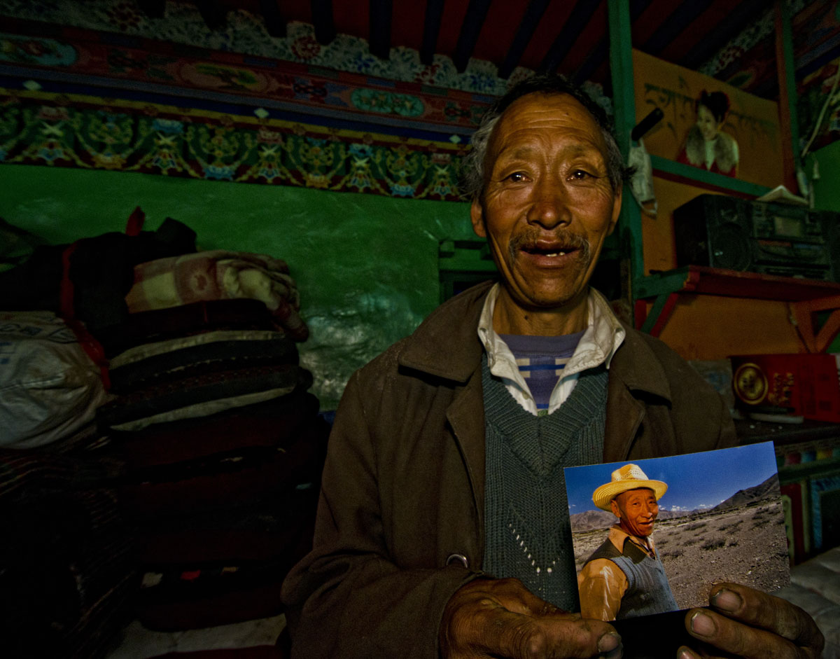 Happiness is… Trilnen Dhongtso of Dhongtso 5 (Zha Lin) village holding a picture of him shot the previous year. He told RWH that many tourists came and took pictures and promised to send them, but RWH was the first who had actually given him a photo. Photo: Richard W. Hughes