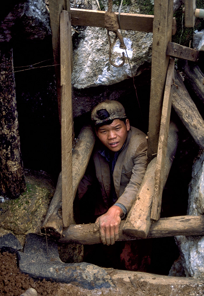 A Kokang Chinese miner emerges from a loodwin at Kyauk Saung, near Mogok
